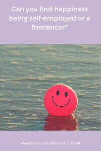 How I’ve Found Happiness as a Small Business Owner - Picture of a red smiley face in water